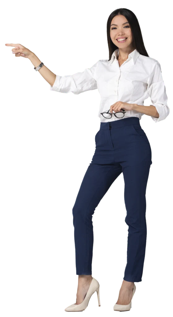Woman in white button-up shirt and navy pants pointing with glasses in hand, wearing beige heels