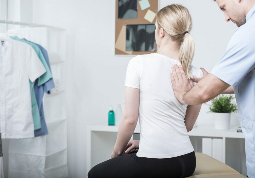 Chiropractic doing spinal mobilisation in physiotherapist's office